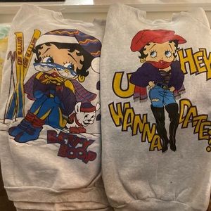 Two Betty Boop sweatshirts. Size XL. One brand new , one slightly used.